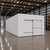 Large white drive-in freezer with sliding door and insulated panel walls