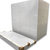 White walk-in cooler unit with closed hinged door, featuring insulated panel walls back right view