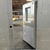 Silver drive-in cooler inside view of small door partially open