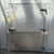 Drive-in freezer with floor outside straight photo of door.