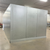 Silver galvanized walk-in freezer with floor exterior back left view.