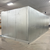 Silver galvanized walk-in freezer with floor exterior back right view.