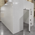 Front view of white walk-in cooler unit with open hinged door, showing interior.