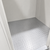 White walk-in commercial freezer view of floor