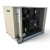Front-left view of a used Climate Control CDS0750L6D 7.5 HP condensing unit #335, an enclosed tan cabinet with a wire coil guard, twin fans, and blue inventory tag #335.