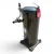 Front view of a used Copeland ZF15K4E-TF5 5.5 HP compressor, a tall black scroll-style shell with a red inventory tag "173" hanging from a cable tie near the top cap, service valve with black cap on top, and a four-bolt gray mounting base.