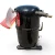Front-right view of the used Copeland CF04K6E-TF5 1 HP compressor, showing a copper service valve with brass fitting at top, a red inventory tag "317" with white and yellow caution flags, and the mounting base with rubber isolator feet.
