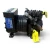Front three-quarter view of a used Copeland KALA-015E-TAC 1.5 HP compressor, 3 phase 208-230 volt, black cast-iron housing with a ribbed motor shell, blue Copelametic rating nameplate, foil-wrapped copper suction line, and a yellow "ADD OIL TO COMPRESSOR" tag hanging from the base.