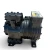 Similar opposite-side angle of the used Copeland ERCA-021E-TAC 2 HP compressor, 3 phase 208-230 volt, slightly rotated to show the mounting feet and the stamped casting numbers on the base.