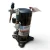 Another angled view of the used Copeland ZF06-K4E-TF5 2 HP scroll compressor, 3 phase 208-230 volt, rotated slightly further with the nameplate still visible and the hanging tags repositioned near the valve assembly.