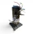 Rotated view of the same used Copeland ZS19KAE-PFV 2.5 HP scroll compressor, 1 phase 208-230 volt, showing the colored wire leads repositioned around the base and the red inventory tag partially visible at the top.