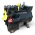 Rotated three-quarter view of the same used Copeland ERFA-031E-TAD 3 HP compressor, 3 phase 460 volt, showing the nameplate and terminal box from a different angle with the yellow oil tags bunched together near the valve.