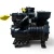 Rear view of the used Copeland LACA-031A-TAC 3 HP compressor, 3 phase 208-230 volt, showing the stamped casting number on the base with a second compressor blurred in the background.