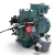 Front-left 3/4 view of the used Carlyle 06DM8086GC3250 3 HP semi-hermetic compressor (3 phase, 208-230 volt), a teal cast-iron unit with a red round inventory tag numbered "257", a braided steel line, and a gray oil-safety-control canister mounted at the front base.