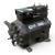 Front-left view of the used Copeland 2DL3-0400-TFC 4 HP Discus compressor (3 phase, 208-230 volt) rotated to show the terminal box with a colored caution sticker, the valve-plate bolts, and the mounting feet with light surface rust.