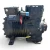 Front-left 3/4 view of the used Copeland NRB2-040A-TFD 4 HP semi-hermetic compressor (3 phase, 460 volt), showing the "Copeland Copelametic" nameplate reading "NRB2-040A-1FD-600", a blue rubber cap on a fitting, and a red round inventory tag numbered "486".