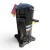 Front-right view of a used Copeland ZB38KCE-TF5 5 HP scroll compressor, 3 phase 208-230 volt, showing the valve stem, red-taped fitting, and yellow "ADD OIL TO COMPRESSOR" tag hanging at the top.