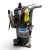 Front-right view of a used Copeland ZF18KVE-TF5 6 HP scroll compressor (3 phase 208-230 volt), showing an oxidized teal-green copper discharge line curving upward, a red inventory tag, and a yellow "ADD OIL TO COMPRESSOR" caution tag.
