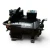 Straight-on front view of the used Copeland 2DA3-075E-TFC 7.5 HP compressor, 3 phase 208-230 volt, showing its gray and black two-tone housing and a plain silver Emerson Copeland nameplate without Discus branding.