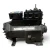 Three-quarter front-left view of the used Copeland 3DEH-R10ML-TFD 7.5 HP compressor, 3 phase 460 volt, with a gray-black housing, blue Copeland Discus nameplate, and a red inventory tag hanging from the top valve.