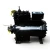 Three-quarter front-right view of a used Copeland 3DJH-F33KE-TFD 7.5 HP compressor, 3 phase 460 volt, with an olive-gray housing, silver Copeland Discus nameplate, and a red round inventory tag hanging near the top valve alongside a yellow tag.