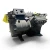 Side view of the used Copeland 4DA3-F47KL-TSK 10 HP compressor, 3 phase dual voltage, showing a yellow "Add Oil To Compressor" tag and the valve fitting on the bolted cylinder head.