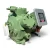 Front view of the used Carlyle 06DR3376DC367 10 HP compressor showing a foil-wrapped copper suction line on the left side, the terminal box at upper right, and the green cast housing with visible mounting feet.