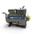 Front-left three-quarter view of a used Copeland 3DF3-R15ML-TFC 12 HP compressor (3 phase 208-230 volt), dark gray semi-hermetic housing with the blue "Copeland Discus" nameplate, an oxidized green copper discharge line curving out to the right, and a red tag hanging near the crankcase.
