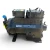 Front-right three-quarter view of the used Copeland 3DS3-R17ME-TFC 15 HP compressor, showing a red round inventory tag numbered "184" wired to the valve stem, a yellow service tag, and a blue-capped fitting on the right side.