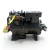 Front three-quarter view of the used Copeland 9RS1-150A-TSC 15 HP compressor (3 phase 208-230 volt), black housing with a red round inventory tag numbered "124" at lower left and a yellow "ADD OIL TO COMPRESSOR" tag wrapped around a copper fitting near the top.