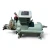 Side profile view of the used Carlyle 06TRC033F2EA 15 HP compressor (3 phase 460 volt) showing the full length of the mint-green shell, the Carlyle nameplate, a rust-streaked coupling flange at the left end, and a foil-capped fitting at the far right.