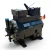 Front-left view of the used Copeland 2DC3-050E-TFC 5 HP Discus compressor (3 phase, 208-230 volt) from a slightly different angle, showing the blue-capped valve at left, the nameplate, and the red inventory tag on the right side.