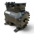 Back-right view of the used Copeland 2DD3-R63KE-TFC 5 HP Discus compressor (3 phase, 208-230 volt), showing the heavily bolted rear valve-plate flange with cast "1350 600" marking and the Emerson/Copeland nameplate visible at the edge.