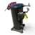 Close top-front view of the used Copeland ZS38K4E-TF5 5 HP compressor, 3 phase 208-230 volt, focused on the domed top with the red round tag "46" and red paper tag prominent, a short copper suction stub protruding to the left, and the cast mounting base with bolt holes visible below.