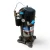 Close-up front view of the used Copeland ZF15K4E-TF5 5.5 HP compressor, 3 phase 208-230 volt, showing a copper line stub wrapped in blue tape and the coiled sensor wire against the black shell.