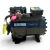 Front-right angled view of the used Copeland 2DA3-F23KE-TFC 6 HP compressor, 3 phase 208-230 volt, showing the bolted cylinder head and the yellow oil-service tag from a rotated angle.