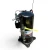 Front view of the used Copeland ZF18K4E-TF5 6 HP scroll compressor showing the "See nameplate for oil type" sticker, the Copeland terminal box, two foil-wrapped copper service fittings, and a yellow tag hanging between the valves.
