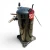Front-right view of the used Copeland ZF18KVE-TF5 6 HP compressor, showing a red inventory tag numbered "207", an open copper stub at the top, and a brass service valve on the left.