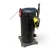 Front-right view of a used Copeland ZF18KVE-TFD 6 HP scroll compressor (3 phase 460 volt), showing a foil-taped copper discharge line, a yellow caution tag, and a red inventory tag hanging by a wire at the top left.