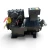 Front-on view of the same used Copeland 9RC1-101A-TFD 10 HP compressor, showing both black mounting feet, the ribbed motor housing, and the yellow oil-service tag and a red tag hanging near the suction valve.