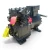 Close three-quarter view of the used Copeland 9RC1-101A-TFD 10 HP compressor highlighting a red round inventory tag numbered "767" and a yellow pressure-test checklist tag with "NITROGEN" checked, hanging from the service valve.