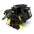 Angled front-left view of the used Copeland 6DL3-F93KE-TSK 27 HP compressor, 3 phase Dual Voltage, showing multiple yellow "Attention" and "Add Oil to Compressor" tags, the copper crankcase heater tubing, and the black terminal box with a green safety label.
