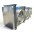 Front-left view of a used Bohn BHE-1200DA evaporator, a large three-fan cream-colored fan coil unit with wood shipping blocks and a Beacon II defrost control.
