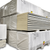 Stacked pallets of insulated cold storage panels wrapped in plastic, showing construction