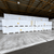 Stacked pallets of insulated cold storage panels wrapped in plastic
