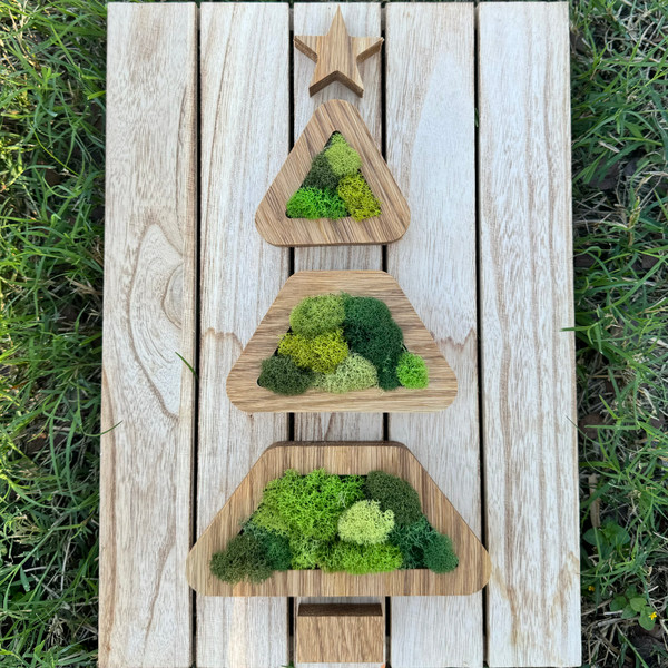 Christmas tree decor crafted from quality wood and real moss.