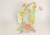 6o6jlmrfil3vv6vm6or6l99i42-15067-14724-14288-13385-14960-14782-14784-gatefold-flower-patty-pan-bleed-through-chennile-stem-lifestyle-1.png