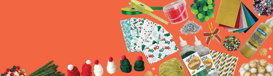 Christmas craft supplies including glitter glue, pom poms, mini beanies, ribbon, festive paper and pipe cleaners