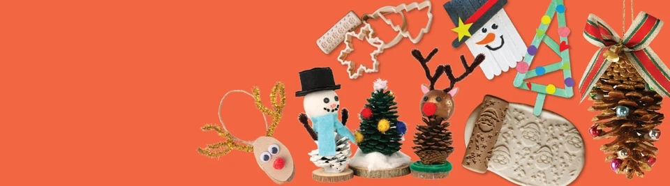 Handmade Christmas decorations made from pinecones, wood slices and popsicle sticks, including a snowman and reindeer