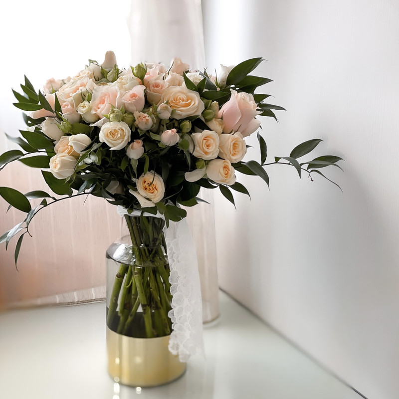 A beautiful heart-shaped arrangement of premium red roses in a vase from BloomGol florist in Houston TX